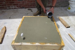 One form was was filled to the top. An immersion thermometer was inserted in the slab and the concrete temperature was recorded for two hours and 40 minutes until right after curing water was applied.