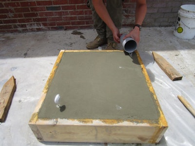 One form was was filled to the top. An immersion thermometer was inserted in the slab and the concrete temperature was recorded for two hours and 40 minutes until right after curing water was applied.
