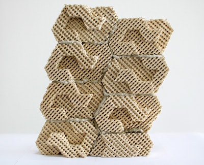 These 3D-printed ceramic bricks are held together with mortar and provide a cool, protective layer against a wall, which helps keep it insulated from heat.