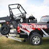 Mad-Ramps stow in place, attached to a trailer hitch receiver, and extend bed space to retain ATVs or other vehicles behind tool boxes or cargo in a crowded pickup truck bed.