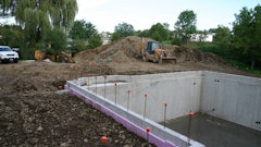 Pictured here is a foundation fully backfilled without a top connection in place. Short walls, corners, offsets and a yard wall provide stability for the backfill before the top connection is in place.