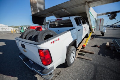 ASRC Energy Services loads a 2015 Chevrolet Colorado on a Shorts 330 cargo aircraft to fly it beyond Alaska's roads to employees managing oil-field construction on the North Slope.