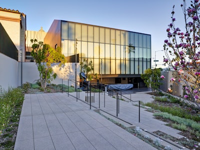 The project called for 940 lineal feet of cast-in-place concrete walls ranging in height from four feet to 14 feet; 34,000 square feet of EcoCast finish pedestrian and vehicular paving and 1,100 lineal feet of cast-in-place steps.