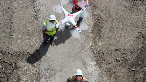 Rogers-O'Brien Construction started flying unmanned aerial vehicles to investigate a building owner's warranty claim, but quickly used them to replace and dramatically improve progress-report images and settle disputes with subcontractors. Collecting photos that will be used to build 3D models of work in progress is next.