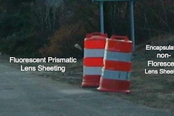 This image from the Virginia Department of Transportation demonstrates the visibility difference between florescent and non-florescent sheeting on construction barrels.