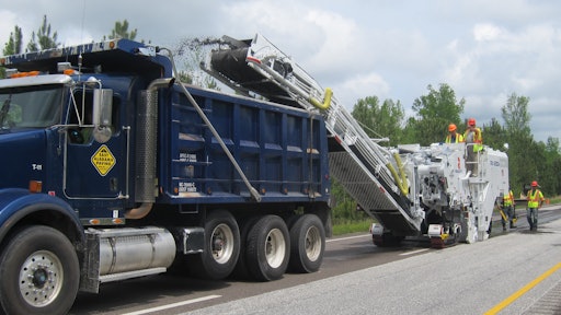 The Roadtec RX-600e, RX-700e, and RX-900e models include a dust extraction system which uses a hydraulic fan to remove dust from the primary conveyor and channel the material to the dump truck alongside the secondary conveyor.