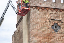 (From left to right) Dean Marks, Skyjack European sales manager, and Ian Brown from Winner Plant assess Laughton Place on the Skyjack SJ63 AJ, which The Landmark Trust used to repoint parts of the historic building.