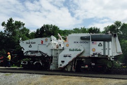 The modified cold planer used on Highway 243 had a 1.5-foot wider frame and no conveyors.