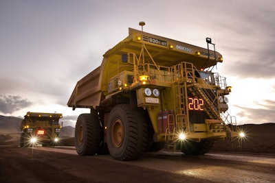 The Komatsu Autonomous Haulage System (AHS) utilizes GPS navigation to maneuver large mining trucks along a planned route, enabling them to complete an entire load, haul and dump cycle unmanned.