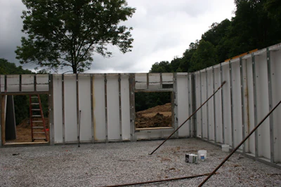 When placement is completed, the walls are fully insulated and studded.