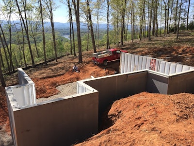 The basic profile of a MonoKast wall includes a 10-inch wide header beam at the top and a 10-inch wide footing beam at the bottom; both of which are 3-1/2 inches thick with solid concrete and reinforced steel. The concrete shell is two inches thick, fiber reinforced, and is 5,000 psi code compliant.