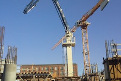 A Putzmeister MX 34/38Z placing boom with a horizontal reach of 110 feet is being used to build vertically on the project.