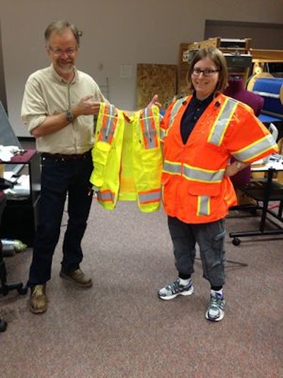 Dr. Tom Martin and Ph.D. student Kristen Hines with the newest prototype of the InZoneAlert construction vest.