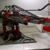The Apis Core 3D printer uses a commercial extruder that rotates in two planes to construct houses layer by layer in a 24-hour period.