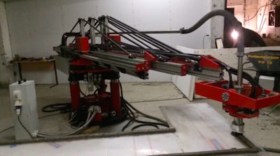 The Apis Core 3D printer uses a commercial extruder that rotates in two planes to construct houses layer by layer in a 24-hour period.