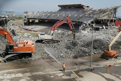 Silverado attached spray nozzles to the excavators, which automatically released water to control dust at the tip of the breaker. This ensured excavator operators had a clear view of the work and eliminated the need for manual dust control, which meant crews could remain a safe distance away from any falling debris. Silverado also had operators controlling nozzles on aerial lifts that were set farther back than the excavator, spraying the point where debris hit the ground.