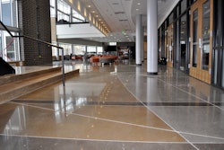 A brand new, state-of-the-art performing arts facility was planned for the Regis Jesuit High School campus in Aurora, Colorado. The owner desired a low maintenance yet natural looking floor for the main lobby and corridor. They also desired a finish that could withstand daily foot traffic and have a low lifecycle cost.