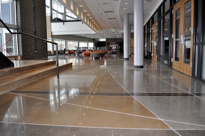 A brand new, state-of-the-art performing arts facility was planned for the Regis Jesuit High School campus in Aurora, Colorado. The owner desired a low maintenance yet natural looking floor for the main lobby and corridor. They also desired a finish that could withstand daily foot traffic and have a low lifecycle cost.