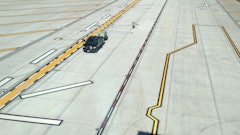 Project cost was estimated around $30 million with the striping subcontract around about $60,000 for Brian Boatner, president of Roads & Runways, and his son Ben. They completed 70,000 sq. ft. of striping in a short two week timeframe.