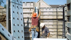 Two-inch (R-10) extruded polystyrene rigid insulation board with structural wall connectors prepared for an insulated sandwich wall configuration.