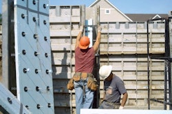 Two-inch (R-10) extruded polystyrene rigid insulation board with structural wall connectors prepared for an insulated sandwich wall configuration.