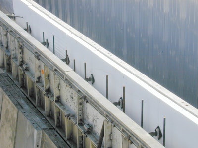 Two-inch (R-8) expanded polystyrene rigid insulation board supported against the outer wall form prior to concrete placement.
