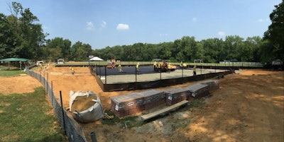 “The paving of tennis courts, sports courts, and running tracks is what we call the plastic surgery of paving,” says Eric Finley, owner of Finley Asphalt. “The smoothness tolerance is typically ¼” when checked with a 10’ straight edge, and of course no standing water. The goal is to have the asphalt surface as flat as possible with just enough slope to drain the water off. Typically most parking lots are designed with 1.5% to 2% slope. Sports surfaces range from .83% to 1%.”