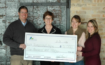 From left to right: Carl Wistreich, President and CEO of AC Business Media; Barb Endl, Executive Director, Tomorrow's Hope; Kayla Brown and April Van Etten, representing the AC Business Media employees