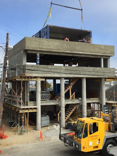 The top floor of the house is where the master bedroom is located. Three steel containers were lifted into position to form the bedroom walls. The doors at either end can be opened to view the ocean and allow breezes to flow through.