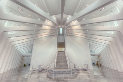 The USF Polytechnic 555 Building, Lakeland, Fla. won the WOW! Award, best overall project for Baker Concrete Construction, Ft Lauderdale, Fla. The innovative design in architectural concrete, by Santiago Calatrava and Festina Lente, includes an elliptical-shaped structure highlighted with exposed concrete raker portals. The first architectural concrete constructed were retaining walls with integral concrete seating caps. These walls defined the building’s perimeter from the reflection ponds and total a mile in length.