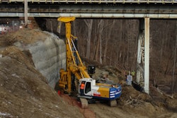 The Bauer BG 18 H Rotary Drilling Rig works in low overhead configuration to install drilled shafts near the Crum Creek Viaduct west abutment with limited overhead clearance. Walsh Construction rented the BG 18 H and BG 20 H from Equipment Corporation of America to install eight 20- to 58-foot-deep, 36-inch-diameter drilled shafts at each pier and 12 at each abutment.