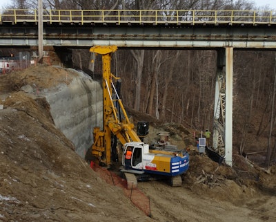 The Bauer BG 18 H Rotary Drilling Rig works in low overhead configuration to install drilled shafts near the Crum Creek Viaduct west abutment with limited overhead clearance. Walsh Construction rented the BG 18 H and BG 20 H from Equipment Corporation of America to install eight 20- to 58-foot-deep, 36-inch-diameter drilled shafts at each pier and 12 at each abutment.