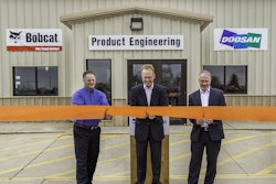 Rich Goldsbury, President, Bobcat and Doosan North America and Oceania (middle) was joined by Gwinner Mayor Dan McKeever (left) and members of the Gwinner City Council for a ribbon cutting ceremony at the renovated Gwinner engineering facility.