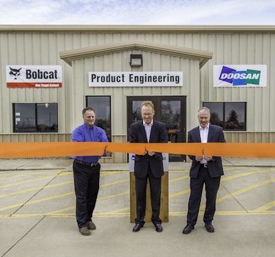 Rich Goldsbury, President, Bobcat and Doosan North America and Oceania (middle) was joined by Gwinner Mayor Dan McKeever (left) and members of the Gwinner City Council for a ribbon cutting ceremony at the renovated Gwinner engineering facility.