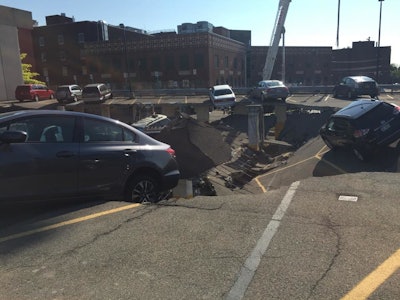 The upper deck of a two-level parking garage connected to the United Health Services Wilson Medical Center in Johnson City, NY, collapsed. Multiple vehicles were trapped underneath the caved in upper section; others tottered precariously on the crumbling top level.