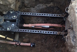 The Same Path slitting head has been retrieved all the way back to the extraction cage, never having left the path of the in situ pipe.