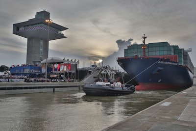 The inaugural transit of the Panama Canal Expansion has begun, as COSCO Shipping Panama enters the Agua Clara Locks.
