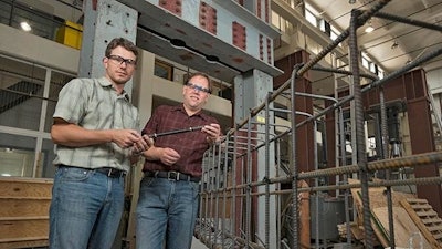 University of Delaware engineers Thomas Schumacher (left) and Erik Thostenson are leading research on a new technique to monitor the health of structures including roads and bridges.