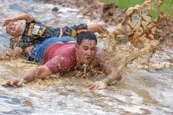 An oversized “mud slide” just in front of the finish line was a new feature this year that proved popular among participants and spectators alike.