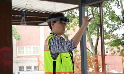 Hololens in use on Gilbane's Boston project building the Dearborn STEM Academy. See video of an augmented-reality view of 3D models that make up the Dearborn STEM Academy plans at the MIT Technology Review site.