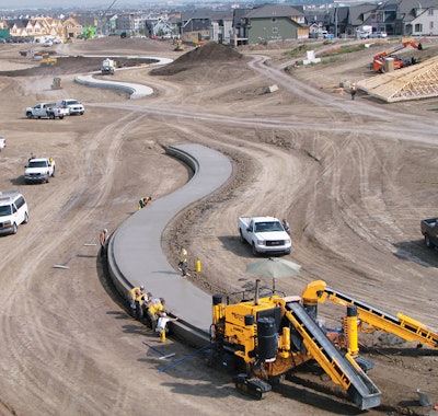 Marmot Concrete used their three-track Commander III, with an extra concrete conveyor, to slipform 2,625 feet of the unique profile. It was their first time slipforming this profile and they completed the work in just 10 days, working 12 hour shifts.