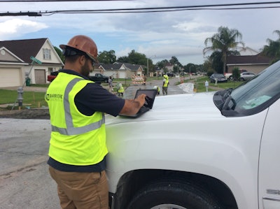 A Barriere employee uses an iPad and B2W's Track program to complete his daily time sheet.