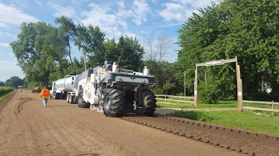 A Wirtgen 240i performs an 8” FDR with oil emulsion.