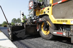 Screed operators keep a close eye on the mat to retain consistency. The goal of the “coffee cup challenge” is for residents to be able to drive down the newly paved street with a cup of coffee and not spill a drop.