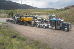 To accommodate the company's heavy hauling needs, Ewing spec'd a 55-ton drop-sided trailer with a ratchet-style gooseneck and a nitrogen-assisted dampening system 4th axle booster.