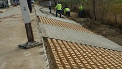 “The slope needed to be stabilized beyond the parking lot because of the steep grade and concerns about erosion,” says Robby Oswald, owner of Bomanite of New Orleans. Grasscrete was the ideal solution because it forms a concrete lattice that allows grass or other vegetation to grow within the voids. In this case it was covered with sod.”