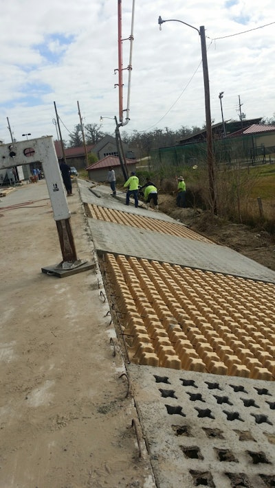 “The slope needed to be stabilized beyond the parking lot because of the steep grade and concerns about erosion,” says Robby Oswald, owner of Bomanite of New Orleans. Grasscrete was the ideal solution because it forms a concrete lattice that allows grass or other vegetation to grow within the voids. In this case it was covered with sod.”