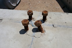 Photo 3 - For misaligned or bent anchor bolts that will not allow the base plate to fit over the bolts, consider bending the bolts into position.