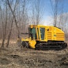 A dedicated mulcher tractor is more likely to have a rugged design with the required safety features built specifically for forestry applications.