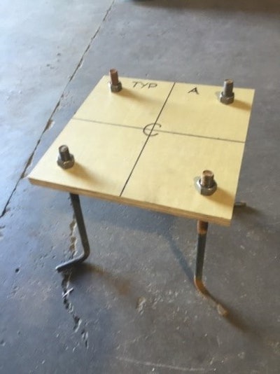 Dennis Purinton with Purinton Builders, Inc. (East Granby, Conn.) makes plywood anchor bolt templates in the shop as shown. Purinton says it is just important to mark the template alignment relative to the foundation as measuring and drilling the bolt holes in the correct location.
